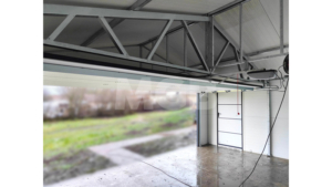6,5×4,5m delux insulated mobile garage with gable roof, white walls, anthracite grey sectional door and door, window, 2 ventilation grilles, cornices, guttering, anthracite grey plywood roof covering
