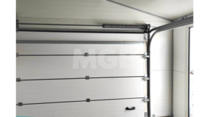 6,5×4,5m delux insulated mobile garage with gable roof, white walls, anthracite grey sectional door and door, window, 2 ventilation grilles, cornices, guttering, anthracite grey plywood roof covering