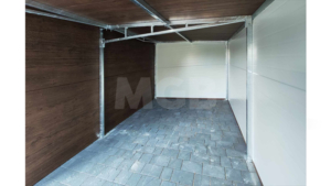 9×5.8m DELUX insulated mobile garage with gable roof, dark walnut walls, anthracite gray sectional door and door, 2 windows, 3 ventilation grilles, internal partition wall, internal door opening, trim, gutter, and anthracite gray tile-effect sheet roof covering
